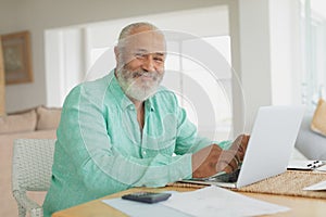 Man using laptop on a table