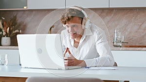 Man using laptop for voice call.