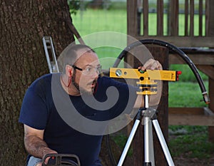 Man Using Laser Level