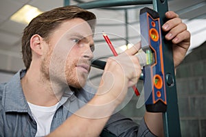 man using leveling tool