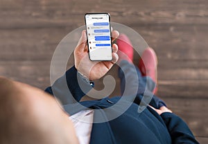 Man using messaging app on phone