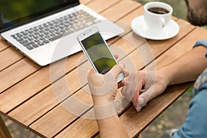 Man using mobile phone in cafe