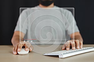 Man using mouse keyboard computer with virtual screen watch videos online streaming.