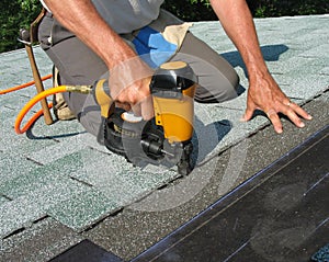 Man using nail gun photo