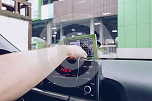 Man is using navigation device inside a car