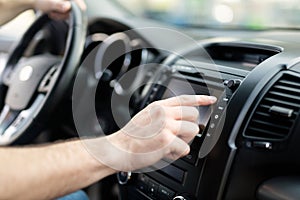 Man using navigation system while driving car