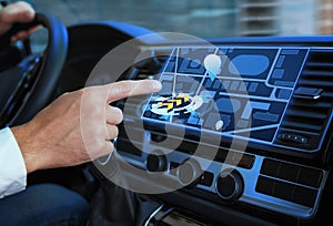 Man using navigation system while driving car