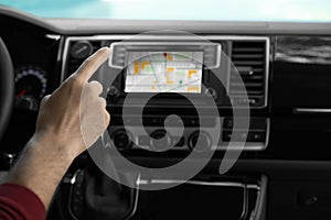 Man using navigation system while driving car