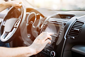 Man using navigation system while driving car