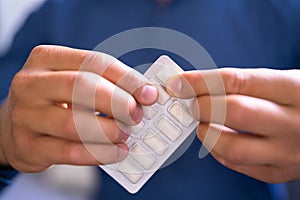 Man Using Nicotine Gum To Quit Smoking