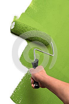 Man Using Paint Roller on Wall