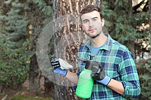 Man using pesticides in backyard