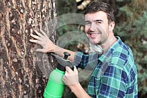 Man using pesticides in backyard