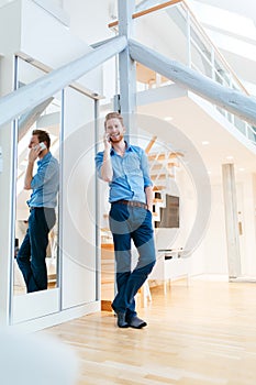 Man using phone in beautiful modern apartment