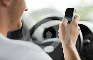 Man using phone while driving the car