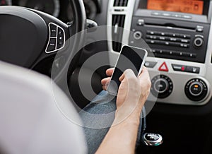 Man using phone while driving the car