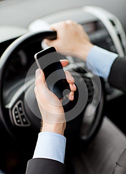 Man using phone while driving the car