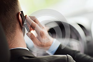 Man using phone while driving the car