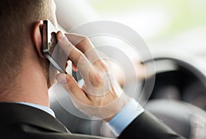 Man using phone while driving the car