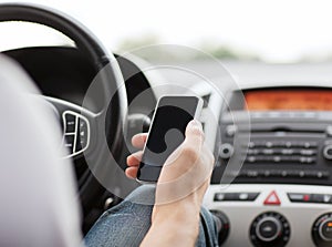 Man using phone while driving the car