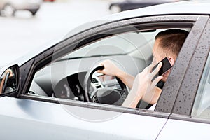 Man using phone while driving the car