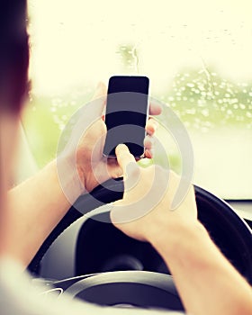 Man using phone while driving the car