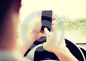 Man using phone while driving the car