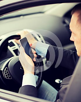 Man using phone while driving the car