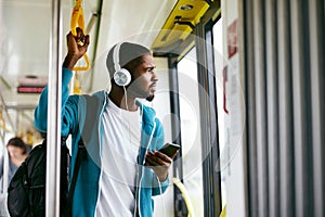 Man Using Phone, Listening Music Traveling In Train