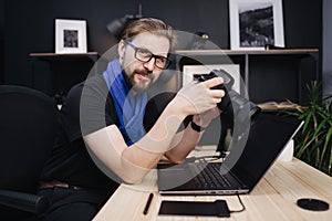 Man using photo camera indoors