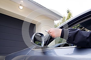 Man by using remote opens garage