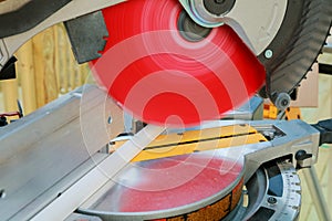 Man using saw to cut wood