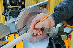 Man using saw to cut wood
