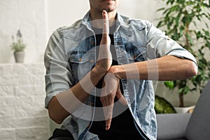 Man Using Sign Language To Communicate At Home