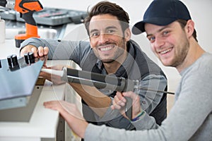 man using silicone tube with apprentice