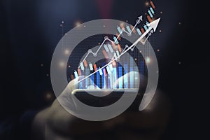 A man using smart phone analyzing graph for data management to make report.