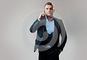 Man using smart phone. Business man in work with phone mobil. Luxury classic suits, vogue. Meeting phone. Man suit