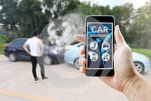 Man using smart phone for car insurance after his accident