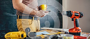 Man using smart phone and holding cup of coffee