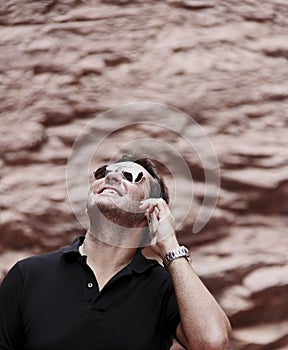 Man using smart phone outdoors