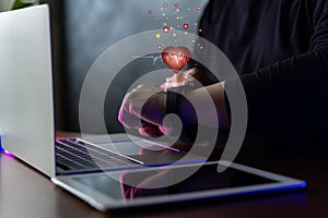 Man using smart watch technology checking heart rate with health app icon on the screen. Holographic icon user interface