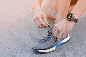 A man using smart watch for tracking running