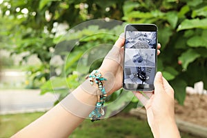 Man using smartphone for monitoring CCTV cameras