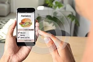 Man using smartphone to order food delivery