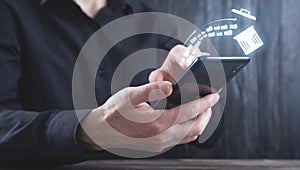 Man using smartphone. Trash can and files. Delete files