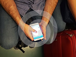 Man using smartphones in the subway
