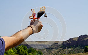 Man using spear thrower throwing rock nature amusement