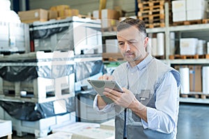 Man using tablet at factory