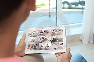 Man using tablet for monitoring CCTV cameras