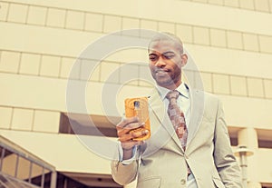 Man using texting on smart phone reading news